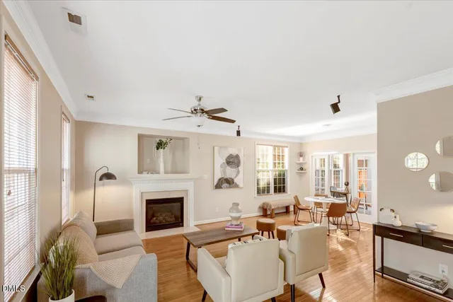 a living room with furniture fireplace and window