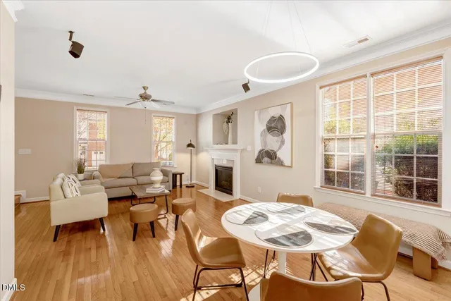 a view of a dining room with furniture window and wooden floor