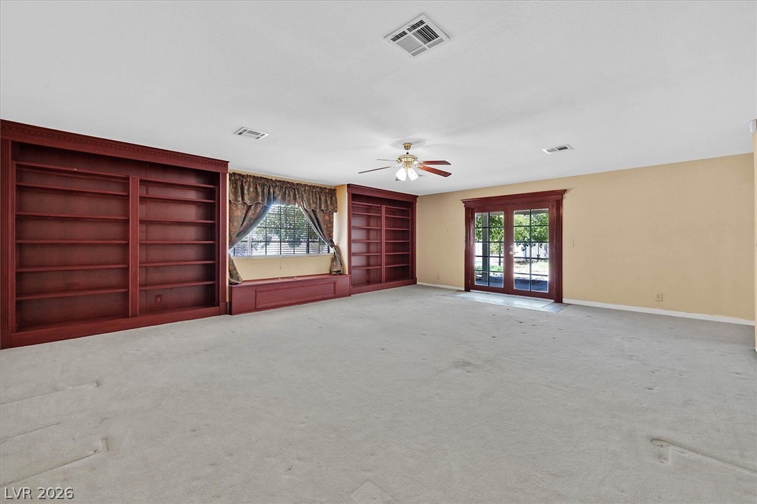 3618 Fieldcrest Road Las Vegas, NV 89121 - Photo 23 of 36 Built-in shelving and French doors complement this spacious and adaptable room.
