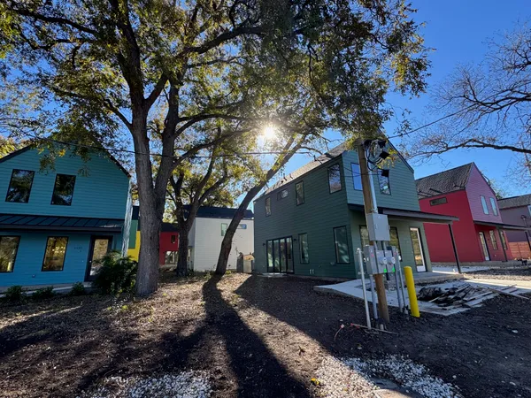 a view of a house with a tree
