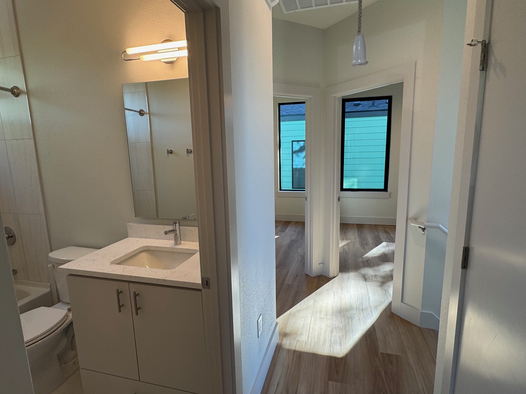 1131 Walton Lane, Unit 3 Austin, TX 78721 - Photo 10 of 16 a bathroom with a sink and a mirror