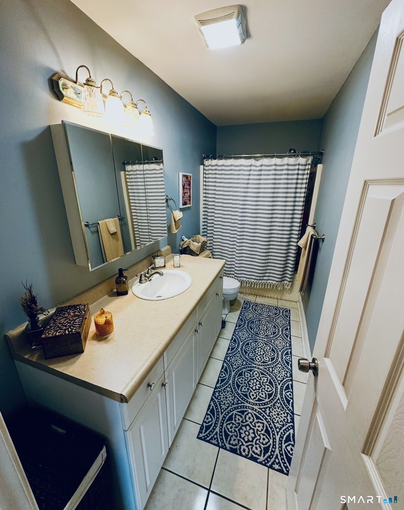 519 Scott Road, Unit 58 Waterbury, CT 06705 - Photo 11 of 19 a bathroom with a sink toilet and mirror