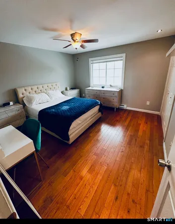 a bedroom with bed and window