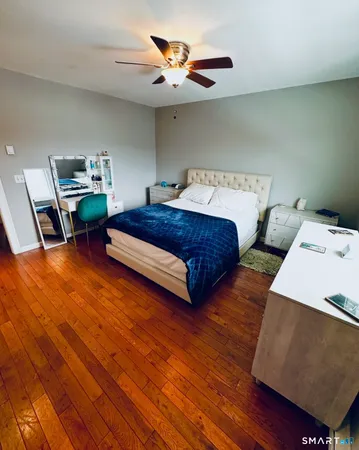 a bed room with a bed and a television