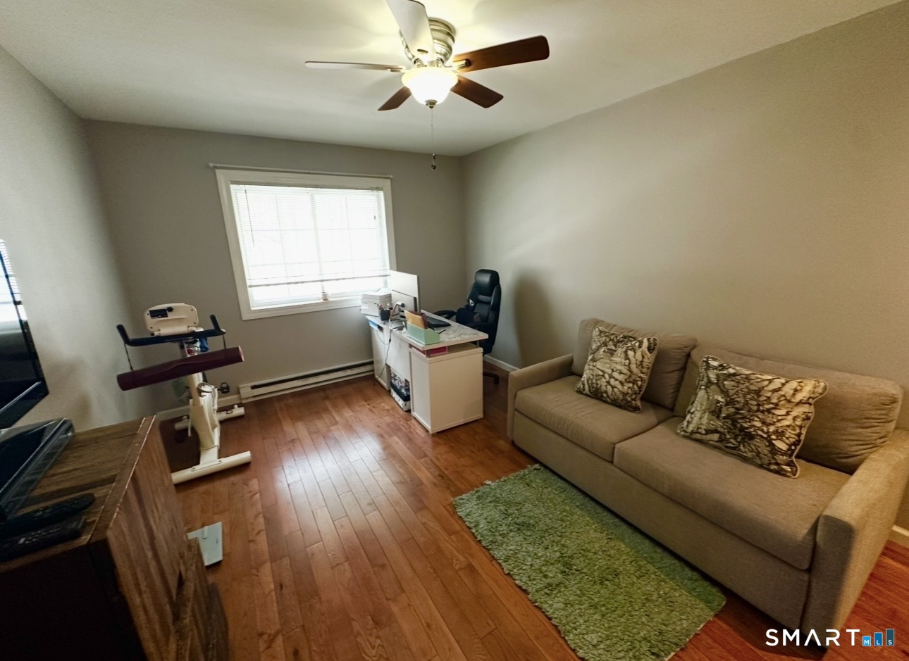 519 Scott Road, Unit 58 Waterbury, CT 06705 - Photo 15 of 19 a living room with furniture and a wooden floor