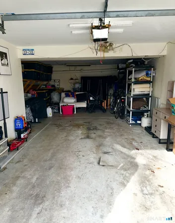 a front view of a house with parking space