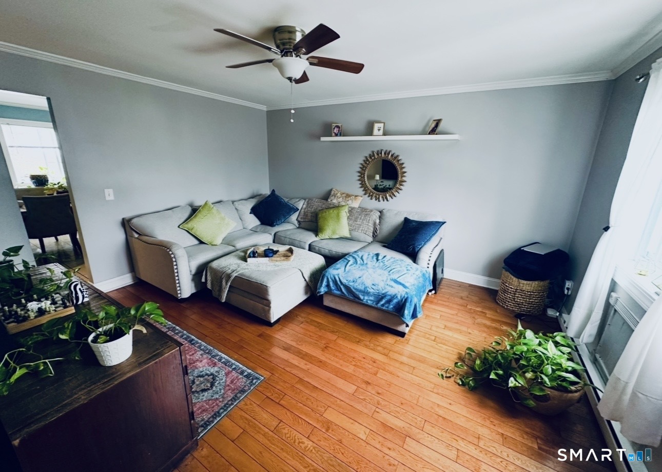 519 Scott Road, Unit 58 Waterbury, CT 06705 - Photo 3 of 19 a living room with furniture and flowers