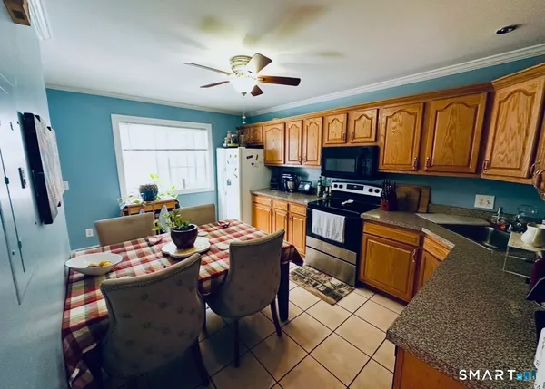 a dining room with furniture and window