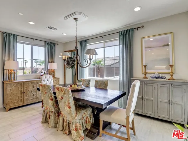 a view of a dining room with furniture window and outside view