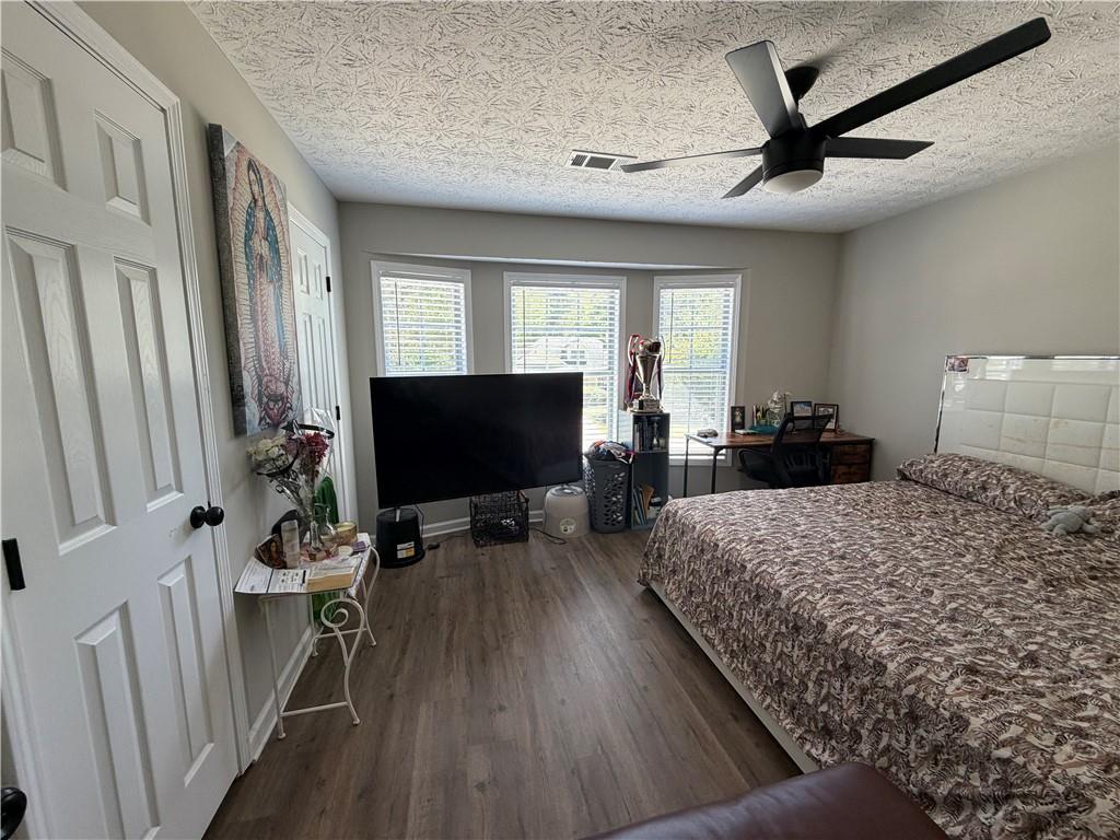934 Bay Ridge Drive Lawrenceville, GA 30045 - Photo 36 of 78 a living room with furniture and a flat screen tv
