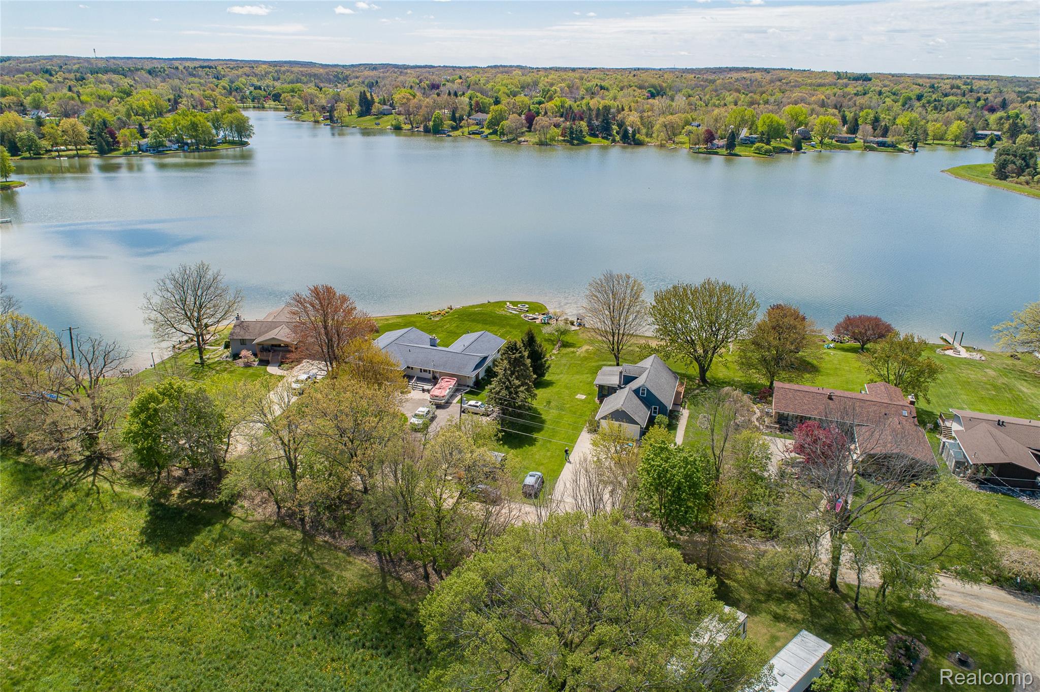 2855 Farmers Creek Road Metamora, MI 48455 - Photo 50 of 51 Expansive lakefront property featuring a serene body of water and lush green surroundings