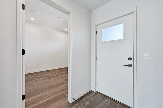 a view of a balcony with floor to ceiling windows