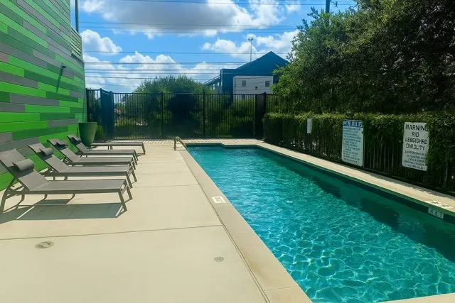 a black and white building in front of gate