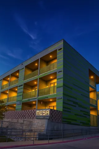 a view of room with wooden floor and fan