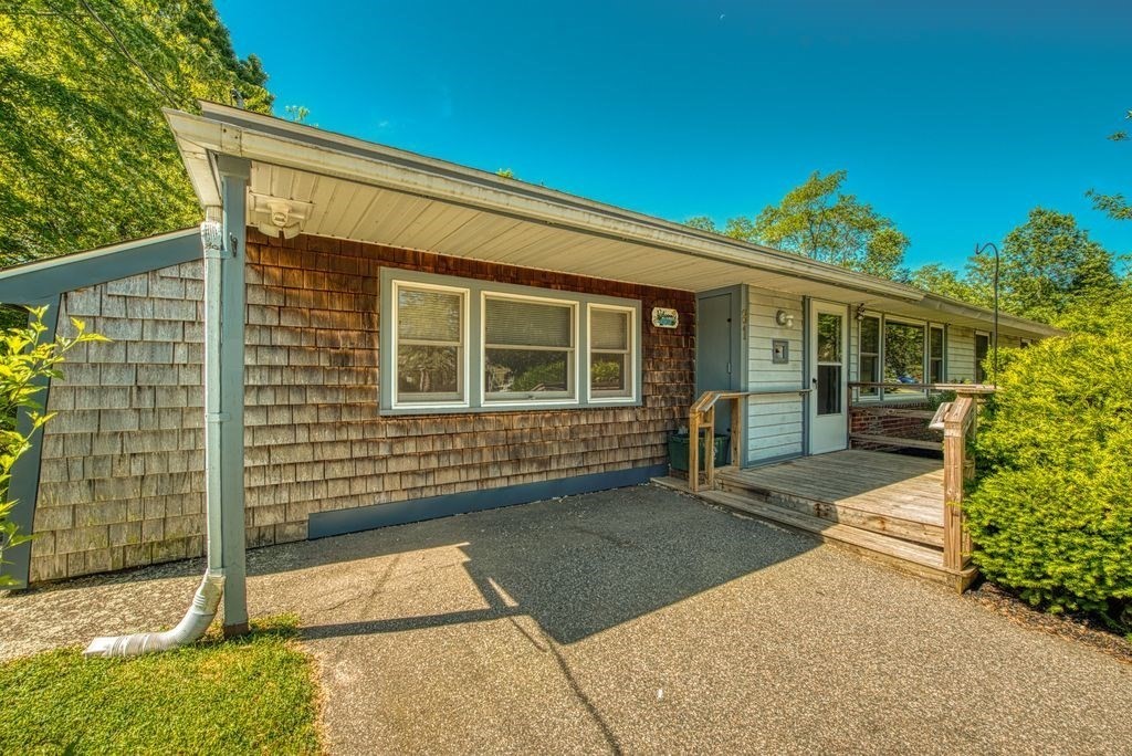 81 Errol Road Brockton, MA 02302 - Photo 3 of 31 a front view of a house with a garage