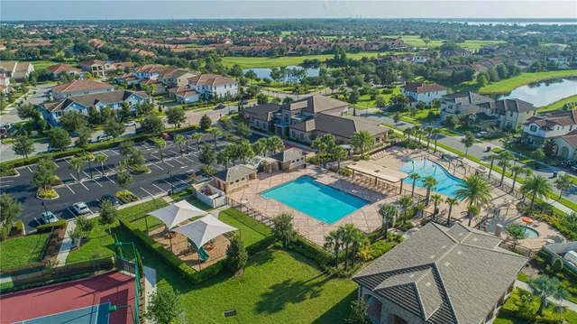 an aerial view of a house with a swimming pool