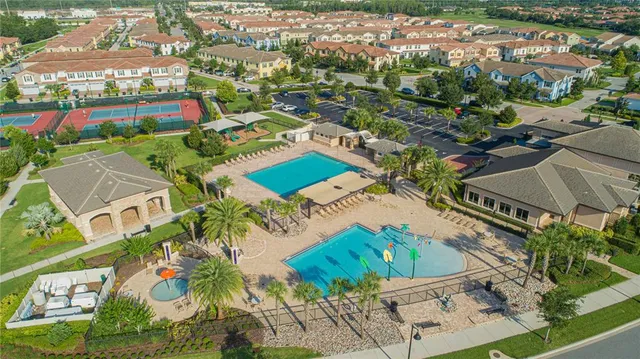 an aerial view of residential houses with outdoor space