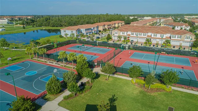 an aerial view of residential houses with outdoor space and street view