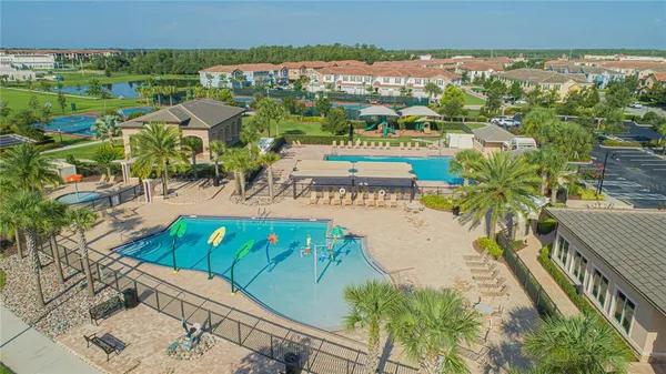 an aerial view of residential houses with outdoor space
