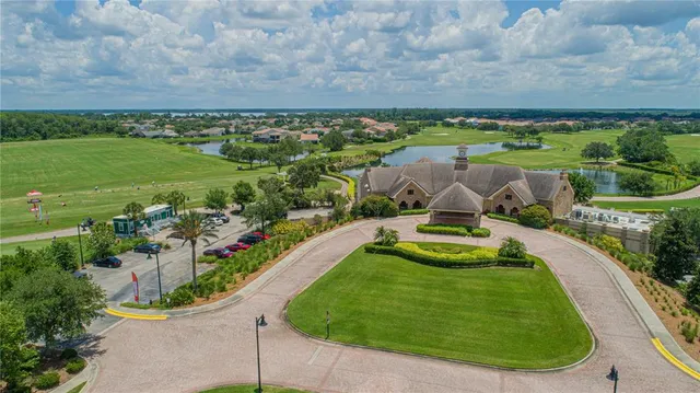 a view of a swimming pool with a yard