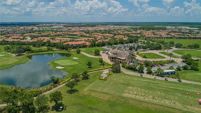 an aerial view of a houses with a yard
