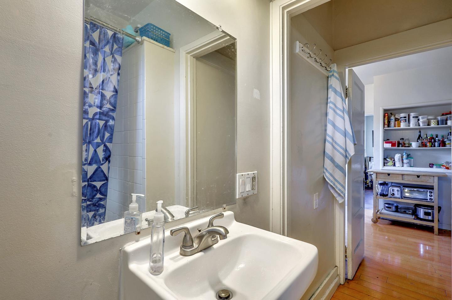 1226 Russell Street Berkeley, CA 94702 - Photo 31 of 38 a bathroom with a sink and a mirror