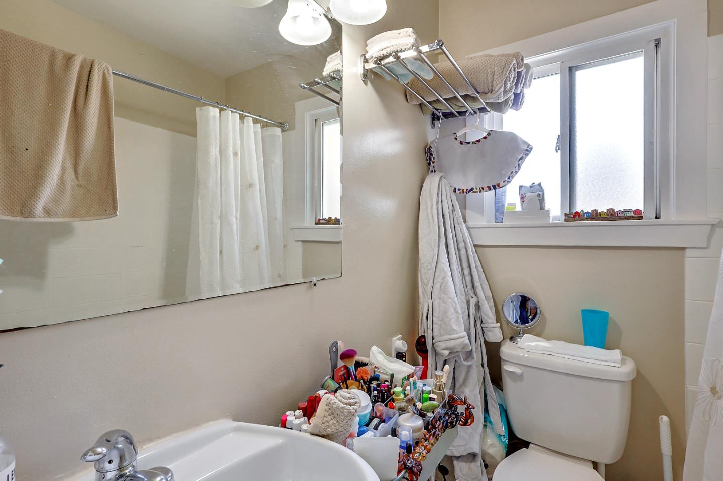 1226 Russell Street Berkeley, CA 94702 - Photo 32 of 38 a living room with furniture and a chandelier