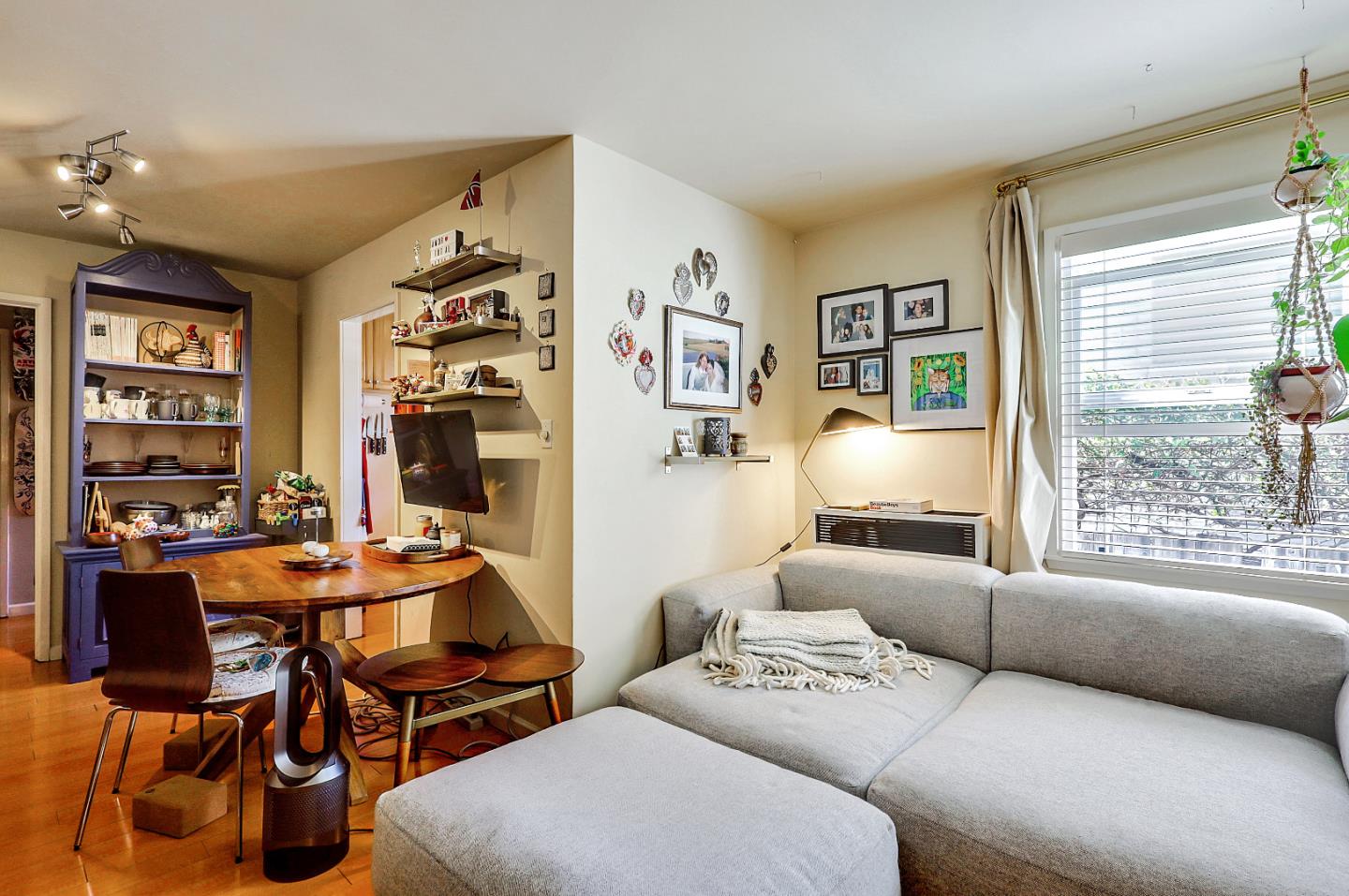 1226 Russell Street Berkeley, CA 94702 - Photo 4 of 38 a living room with furniture a chandelier and a window