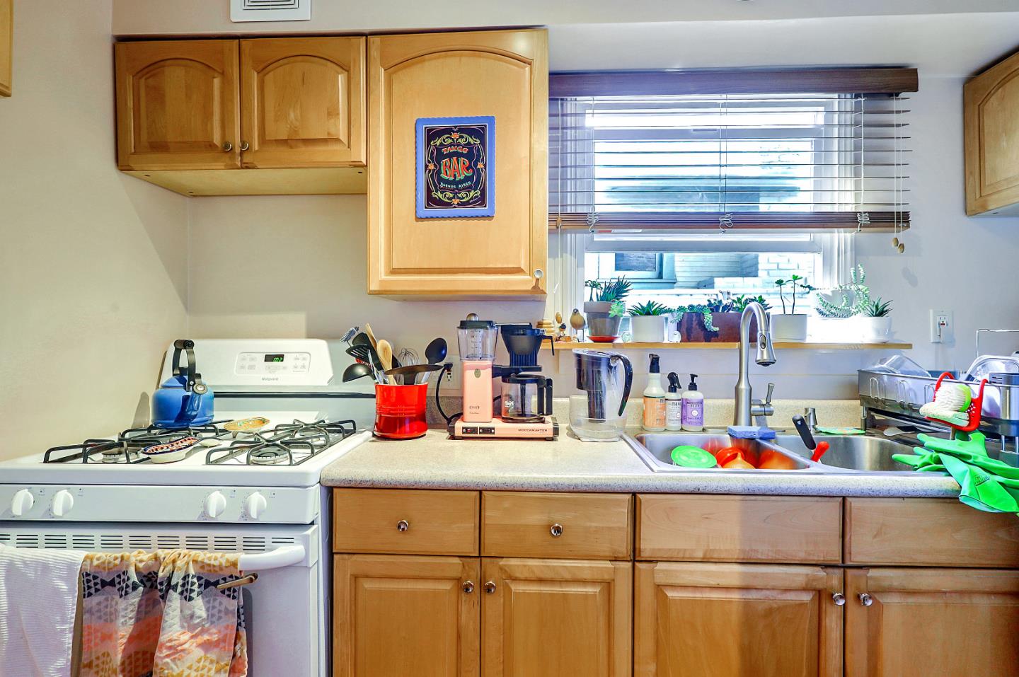 1226 Russell Street Berkeley, CA 94702 - Photo 8 of 38 a kitchen with a stove a sink and a window