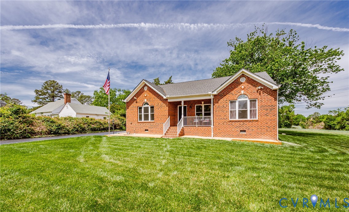 2018 Valentine Road Henrico, VA 23228 - Photo 5 of 65 a front view of a house with a yard and garage