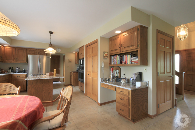 4900 Stockdale Road Morris, IL 60450 - Photo 11 of 33 a dining room with furniture a chandelier and kitchen view