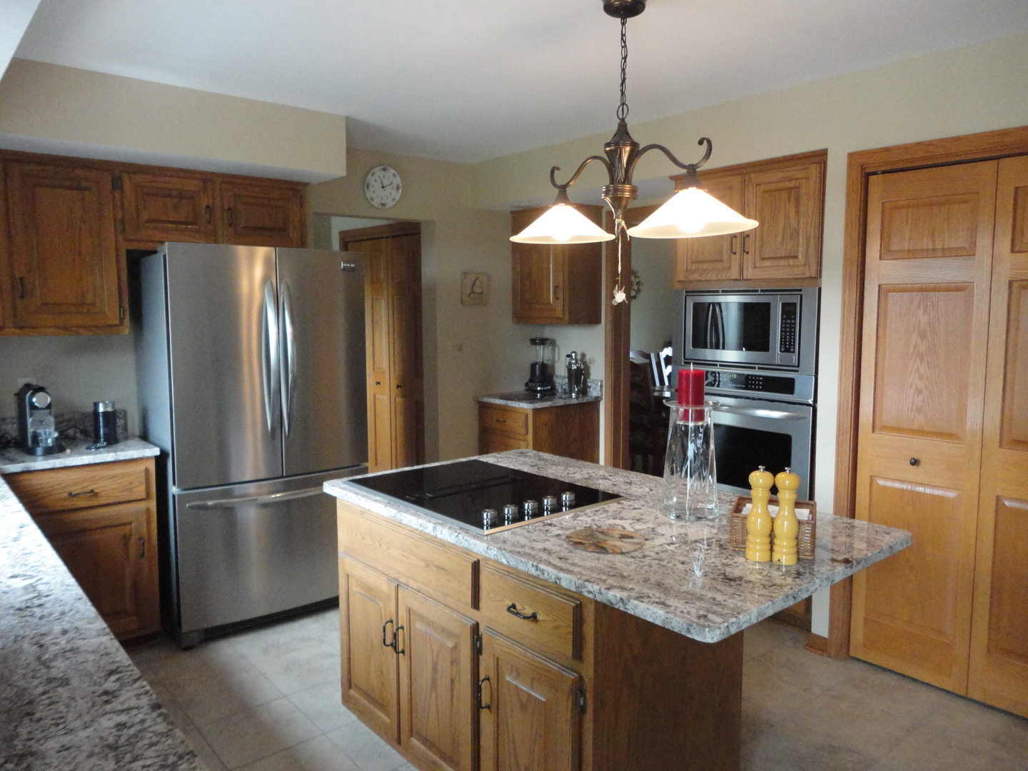4900 Stockdale Road Morris, IL 60450 - Photo 13 of 33 a kitchen with stainless steel appliances granite countertop a sink refrigerator and microwave