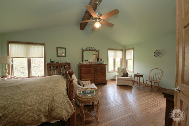 4900 Stockdale Road Morris, IL 60450 - Photo 19 of 33 a living room with furniture a fireplace and a window