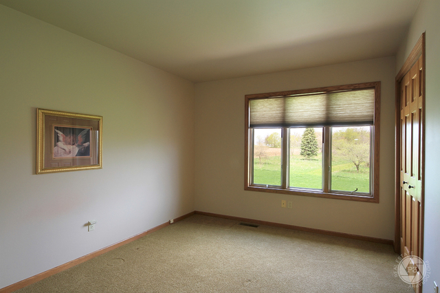 4900 Stockdale Road Morris, IL 60450 - Photo 22 of 33 an empty room with a window