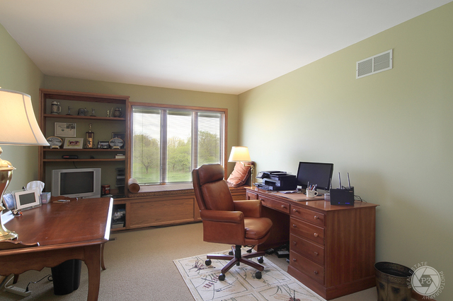 4900 Stockdale Road Morris, IL 60450 - Photo 23 of 33 a work room with furniture lamp and a window