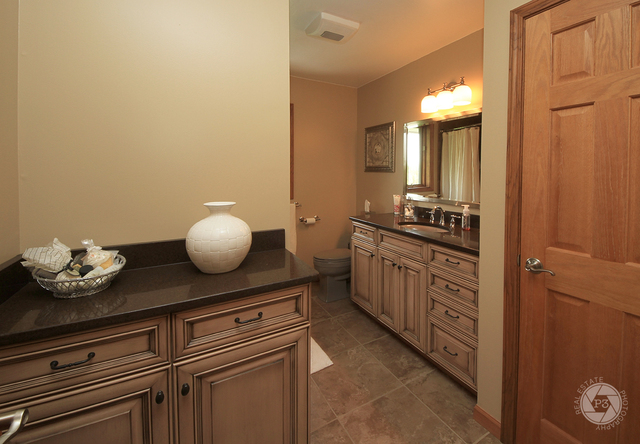 4900 Stockdale Road Morris, IL 60450 - Photo 24 of 33 a kitchen with stainless steel appliances a cabinets and wooden floor