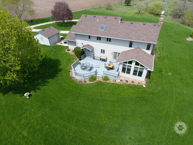4900 Stockdale Road Morris, IL 60450 - Photo 32 of 33 an aerial view of a house with swimming pool garden view and a yard