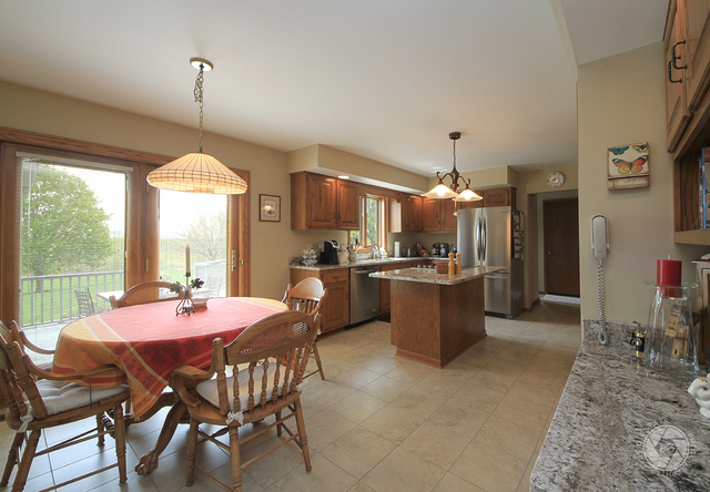 4900 Stockdale Road Morris, IL 60450 - Photo 10 of 33 a dining room with furniture a chandelier and window