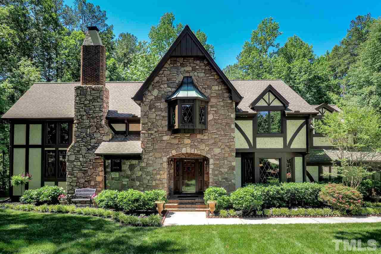 5009 Field And Stream Road Raleigh, NC 27613 - Photo 1 of 12 Exquisite TUDOR style with immaculate detailed craftsmanship nested in the heart of the city.