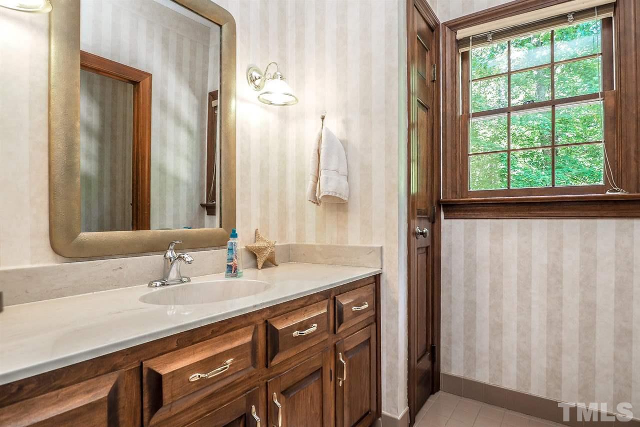 5009 Field And Stream Road Raleigh, NC 27613 - Photo 11 of 12 Bathroom has a GRANITE vanity with great natural surroundings.