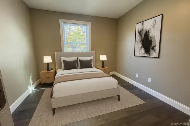 a bedroom with a bed and window