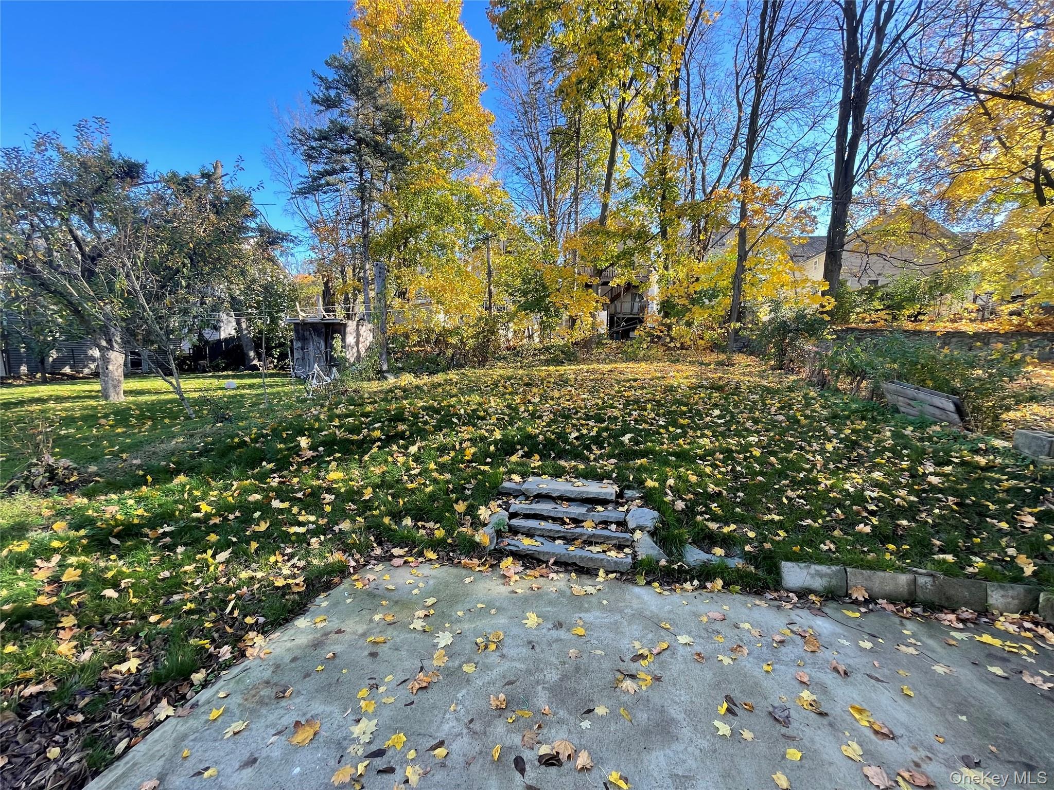101 Delafield Street Poughkeepsie, NY 12601 - Photo 16 of 16 a wooden bench with a view of trees