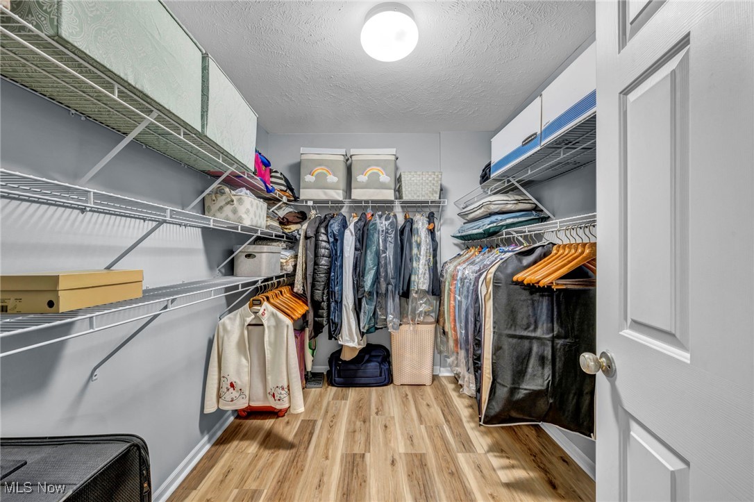 30257 Center Ridge Road Westlake, OH 44145 - Photo 27 of 42 Walk in closet featuring light wood-style floors