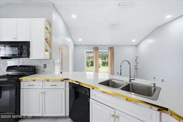 a kitchen with a sink and cabinets