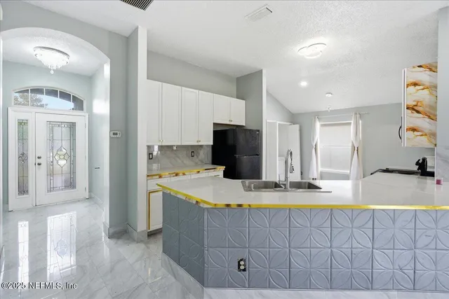 a view of a hallway with entryway door