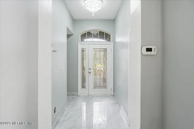 a kitchen with a refrigerator and a sink