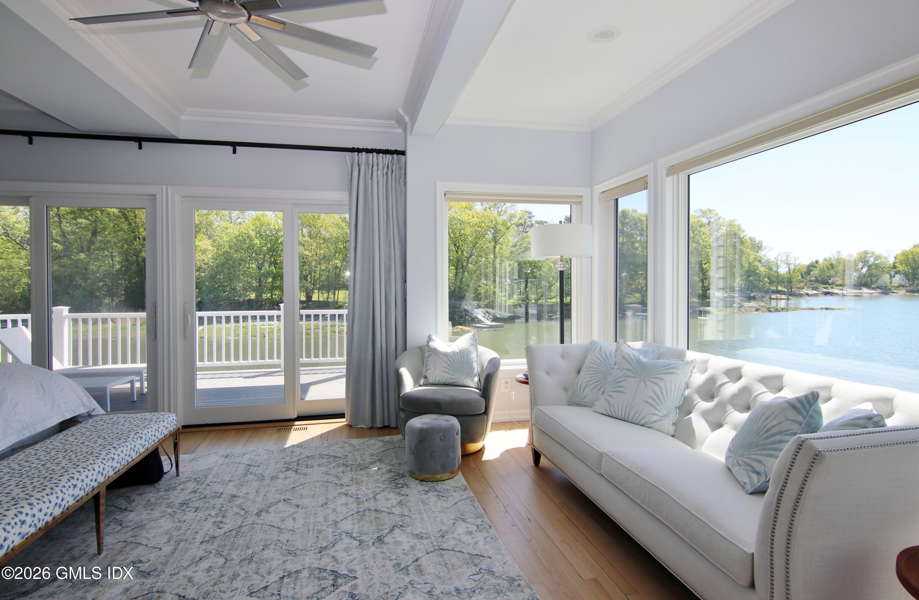 633 Steamboat Road, Unit 5 Greenwich, CT 06830 - Photo 12 of 29 a living room with furniture and a large window