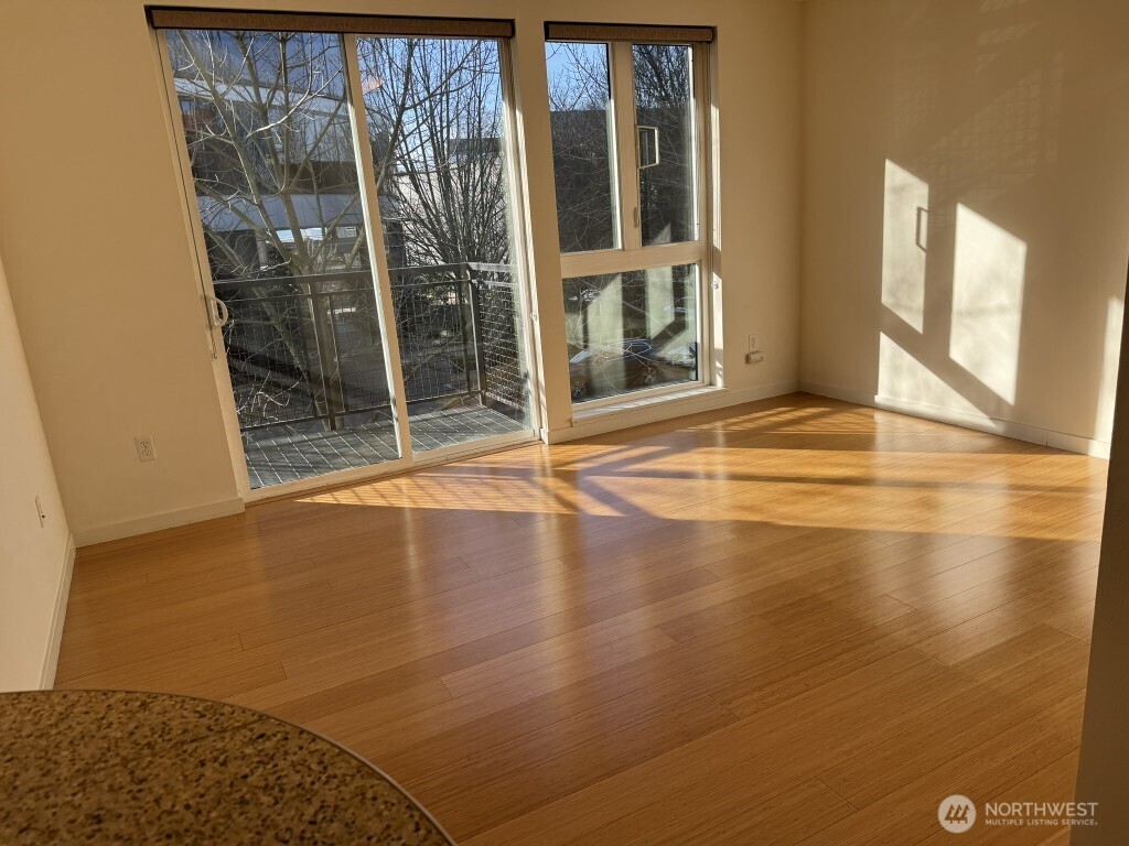 3104 Western Avenue, Unit 215 Seattle, WA 98121 - Photo 14 of 18 a view of an empty room with glass door