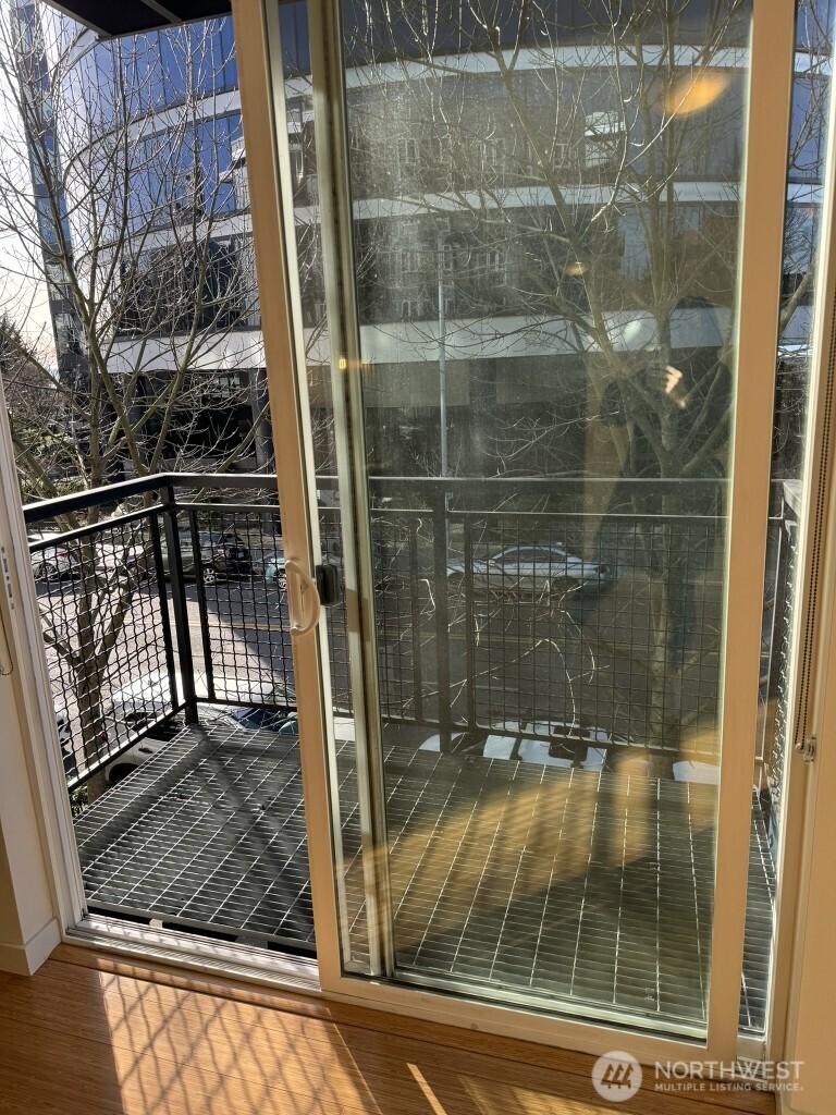 3104 Western Avenue, Unit 215 Seattle, WA 98121 - Photo 17 of 18 a bathroom with a glass shower door
