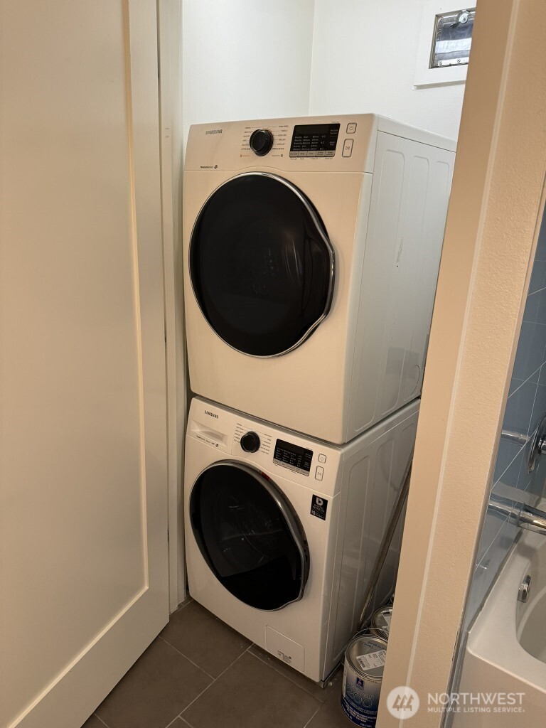 3104 Western Avenue, Unit 215 Seattle, WA 98121 - Photo 2 of 18 a utility room with dryer and washer